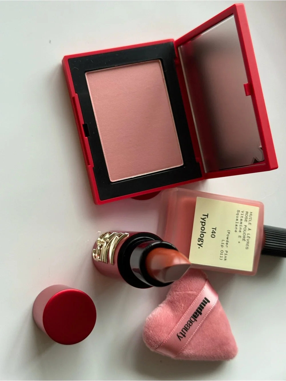 NARS Blush & Lipstick + Typology Lip Oil + Huda Puff